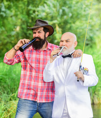 drinking time. retired businessman. male friendship. mature man fisher celebrate retirement. two...