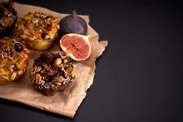 delicious fresh muffins and figs lie on paper