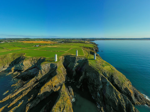 Aerial view, The Metal Man is a 3-metre tall cast-metal figure of a sailor pointing seawards. According to local lore, he is said to warn seafarers away from dangerous shallow waters.