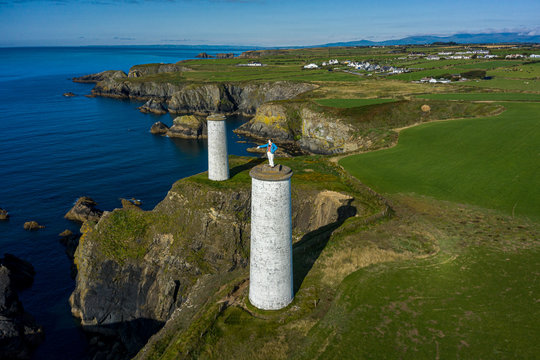 Aerial view, The Metal Man is a 3-metre tall cast-metal figure of a sailor pointing seawards. According to local lore, he is said to warn seafarers away from dangerous shallow waters.