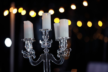 glass candlestick at night on the table