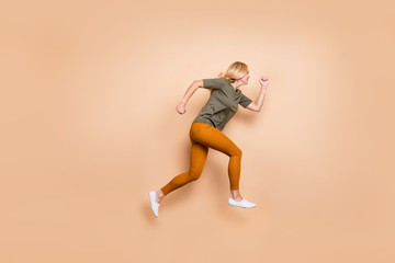 Full body profile photo of crazy lady jumping high speed race marathon participant competitive mood...