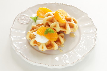 Canned mandarin orange and waffle for gourmet breakfast