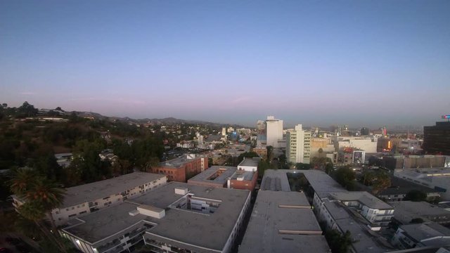 Boom down facing the Hollywood Sign at Sunset 4K