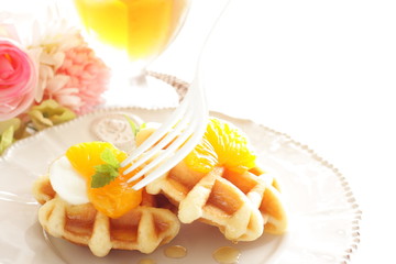 Fototapeta na wymiar Canned mandarin orange and waffle for gourmet breakfast