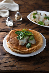 Homemade crepes with smoked fish