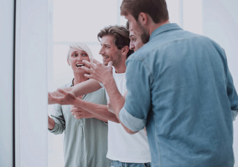 group of employees standing in the office lobby