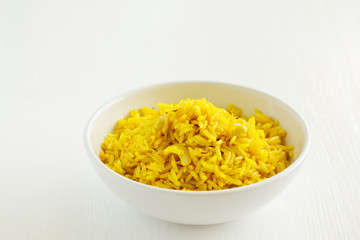 Vegetarian rice with curry and cashew nuts.