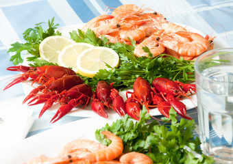 cooked shrimp and crayfish on plate close up