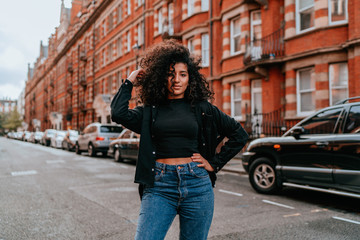 Portrait Charming Young African Woman with Curly Hair, Street Style