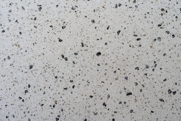 Black and white cut and polished concrete bench top. Background texture graphic asset.