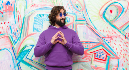 young bearded crazy man scheming and conspiring, thinking devious tricks and cheats, cunning and...