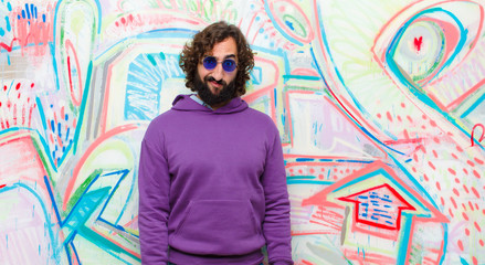 young bearded crazy man feeling confused and doubtful, wondering or trying to choose or make a...