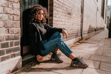 Portrait Charming Young African Woman with Curly Hair, Street Style