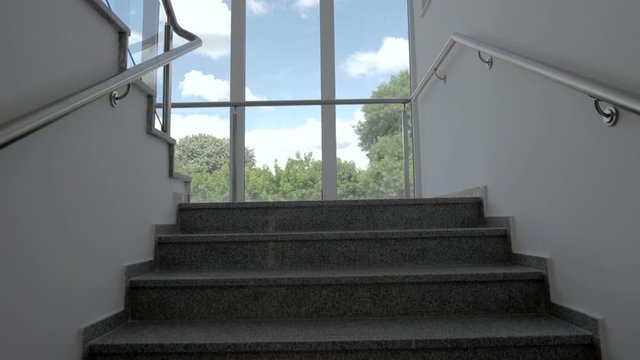 POV Shot Of Going Up A Staircase. Modern Stairs In A Newly Built Facility.