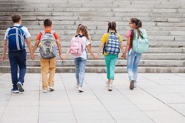 Teenagers with backpacks.