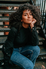 Portrait Charming Young African Woman with Curly Hair, Street Style