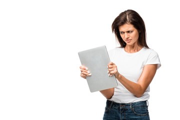 angry young woman looking at laptop, isolated on white