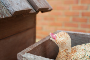 ceramic duck in duck coop