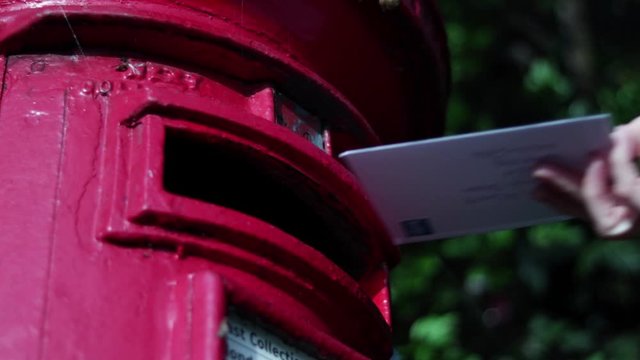 Posting Letter Into English Red Postbox