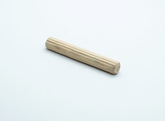 Long size wooden dowel pin isolated on white background.
