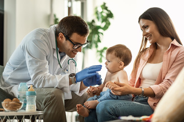 Small boy with mother at pediatrician's.