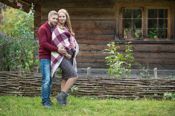 A portrait of young married couple expecting a baby