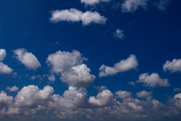 White clouds over a blue sky. Storm Cumulonimbus.