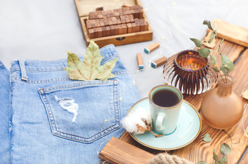 A tray with various objects stands on the bed.