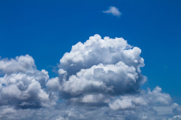 Naklejka na ściany i meble White clouds over a blue sky. Storm Cumulonimbus.
