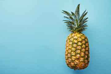 Tasty pineapple on  colored  background, flat lay. Pineapple on a colored background