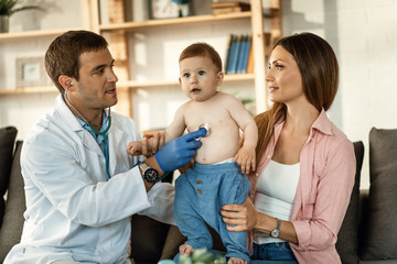 Cute small boy and his mother during medical examination at pediatrician's.