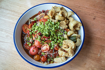 Papaya salad with crispy pork is a popular trays in Thailand.spicy food call name Som-Tum-Poo-Pla-Ra.