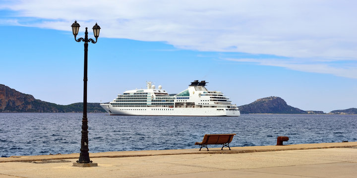 GREECE, PYLOS - 26 SEP, 2013: Cruise ship Seabourn Odyssey shown in Navarino bay. Built in 2009 in Genoa. Although, at 32,000 GRT and length 650 feet, it accommodates just 450 guests in 225 luxury sui