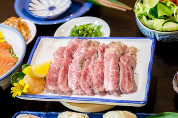 Sliced grilled Strip Loin rare degree of ripeness beef steak served.