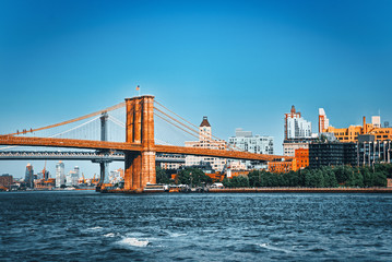 Suspended Brooklyn Bridge across Lower Manhattan and Brooklyn. New York, USA.