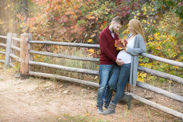Fototapeta na wymiar A portrait of young married couple expecting a baby