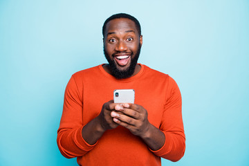 Photo of positive cheerful handsome black man smiling toothily excited about positive news known...