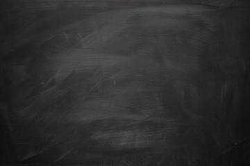 Abstract texture of chalk rubbed out on blackboard or chalkboard background, can be use as concept for school education, dark wall backdrop , design template , etc.