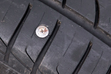 Self-tapping screw on a car wheel