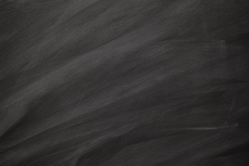 Abstract texture of chalk rubbed out on blackboard or chalkboard, concept for education, back to school, creatively, teaching , etc.