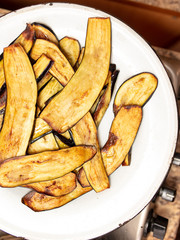 Eggplant fried in oil in a pan