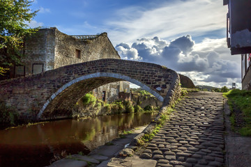 Bridge 208 at Dockfield in Shipley is pictured in vivid evening light and is one of the many packhorse style bridges so beloved of walkers and boaters along the Leeds and Liverpool Canal