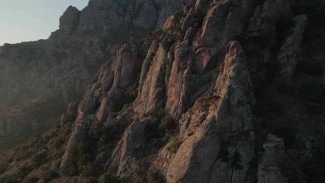 Aerial view amazing stone pillars in mountains in Crimea. Valley of ghosts landmark during sunset