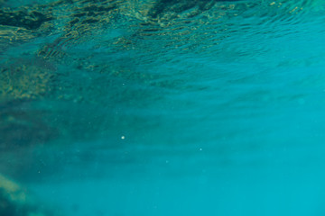 Fototapeta na wymiar Blue underwater bokeh ,light particles. Abstract. Atlantic ocean