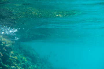 Blue underwater bokeh ,light particles. Abstract. Atlantic ocean