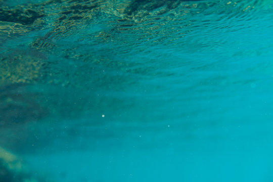 Blue underwater bokeh ,light particles. Abstract. Atlantic ocean © Ксения Левашова
