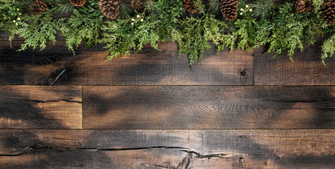 Christmas decoration pine tree branches wooden background © LiliGraphie