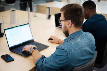 Young men studying in public library