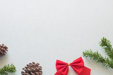 Christmas background with gift boxes, pine cone and decorations on light blue background. Preparation for holidays. Top view with copy space.